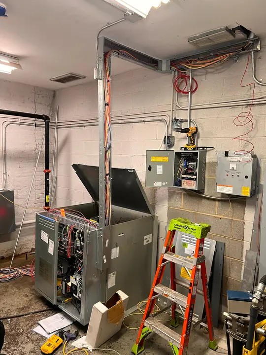 Equipment room with new wireway, conduit and control cabinets being wired