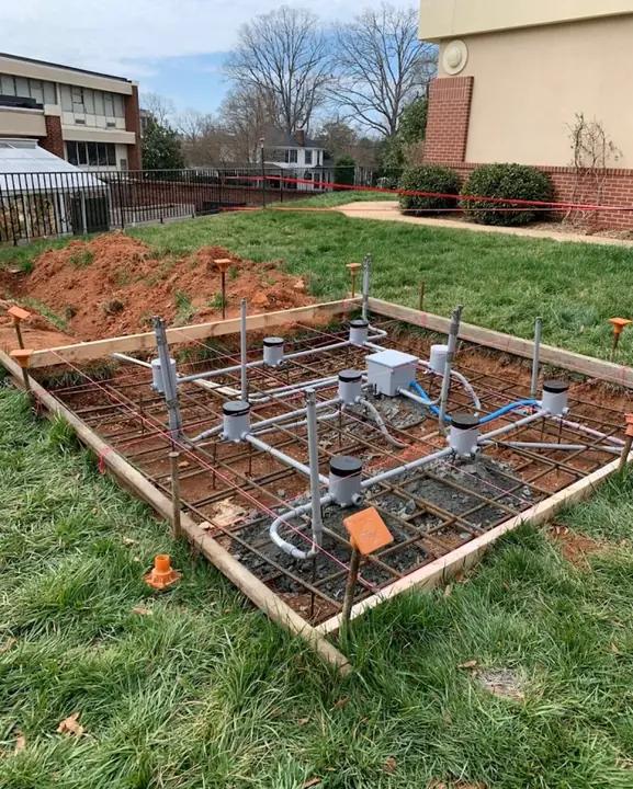 Underground conduit and in-grade light boxes set in rebar before the concrete pour