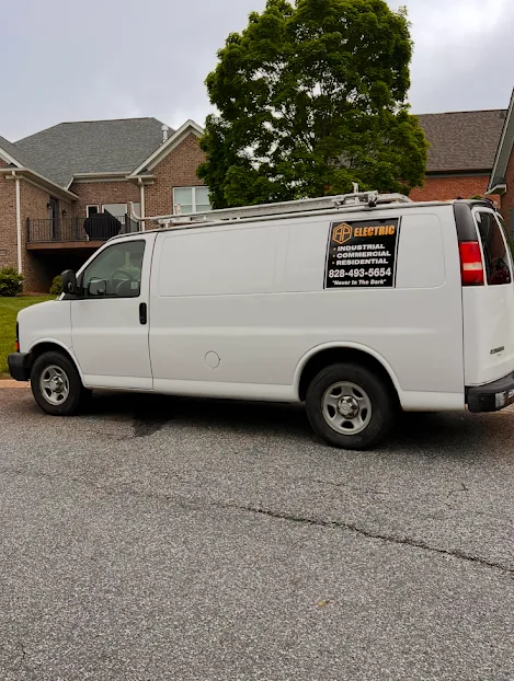 AP Electric work van with the logo, phone number and the line Never In The Dark